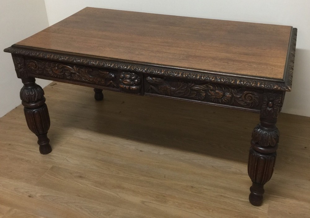 Victorian carved oak two drawer library table