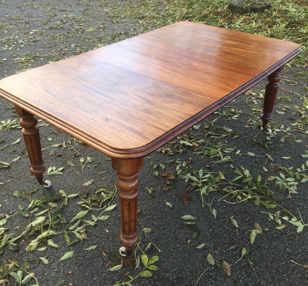 Victorian mahogany six seater wind out table in original condition  