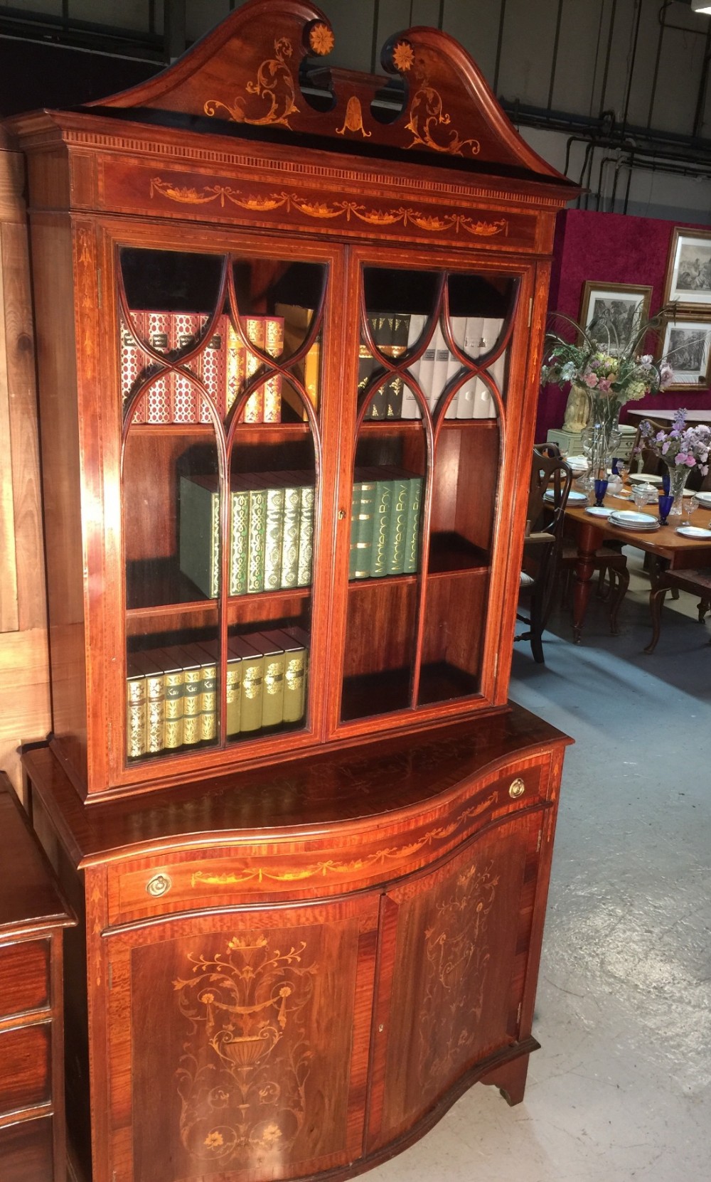Sheraton revival marquetry bookcase on serpentine base
