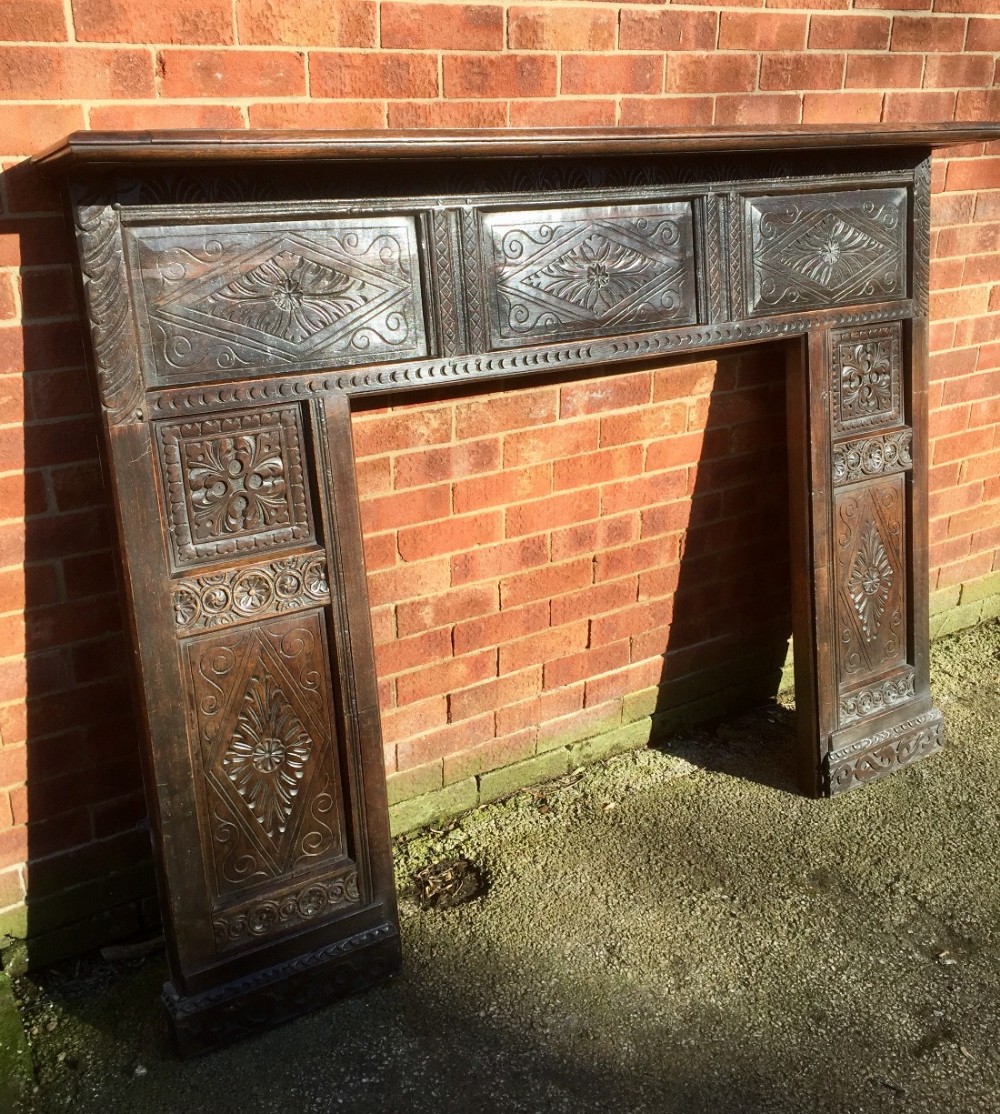 Carved 19th century solid oak fire surround 