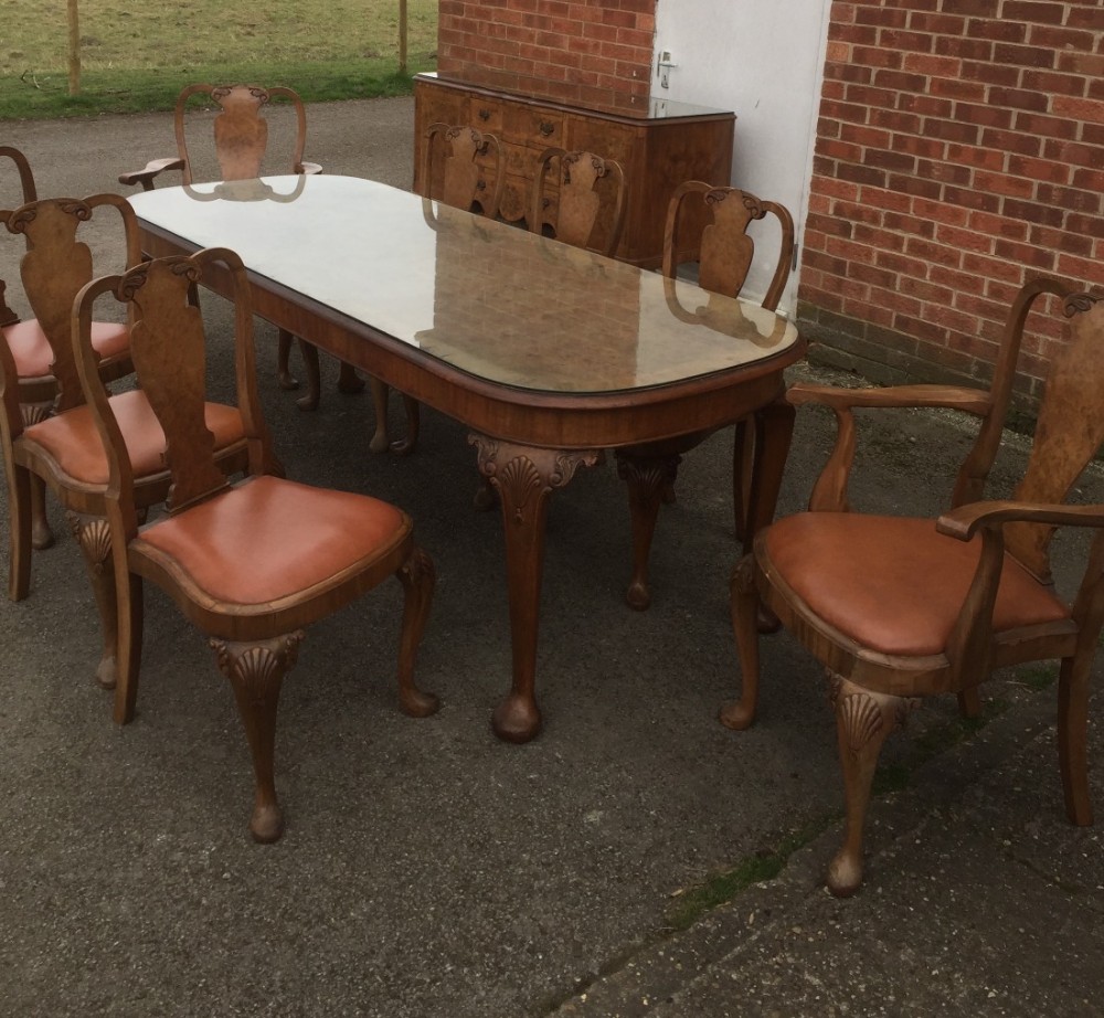 Burr walnut eight Seater table eight chairs and a Sideboard circa 1920