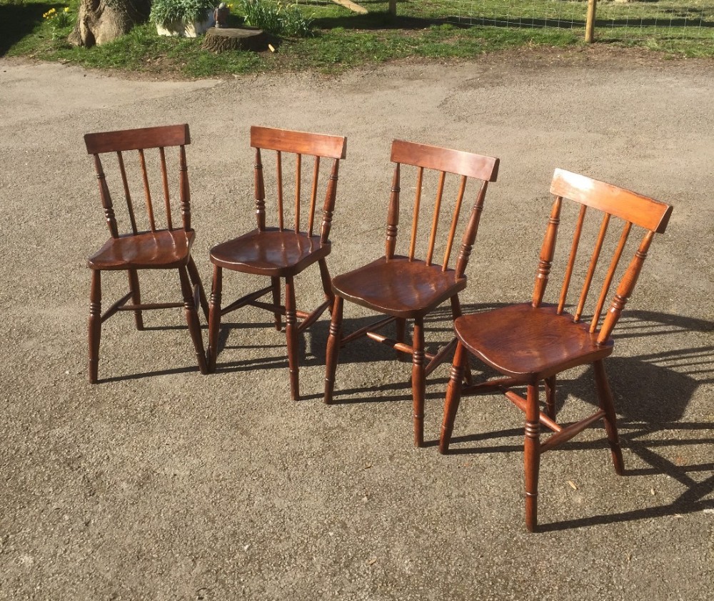 Four nineteenth century elm seated country chairs 