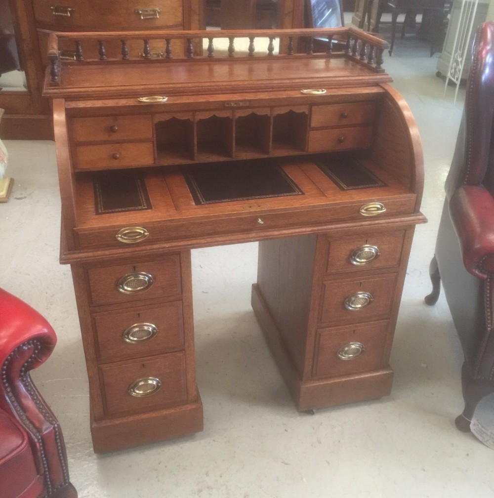 Edwardian golden oak tambour topped desk