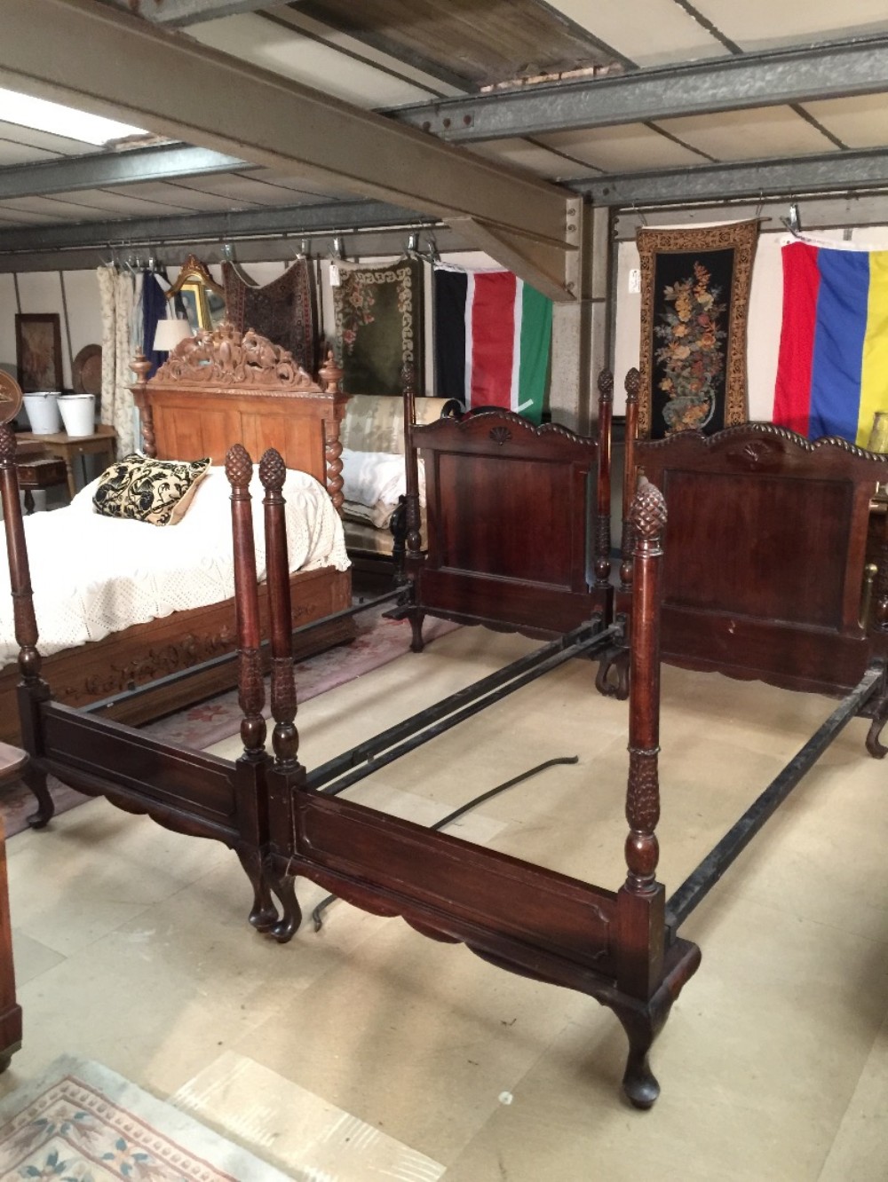 Pair of Edwardian carved mahogany single beds