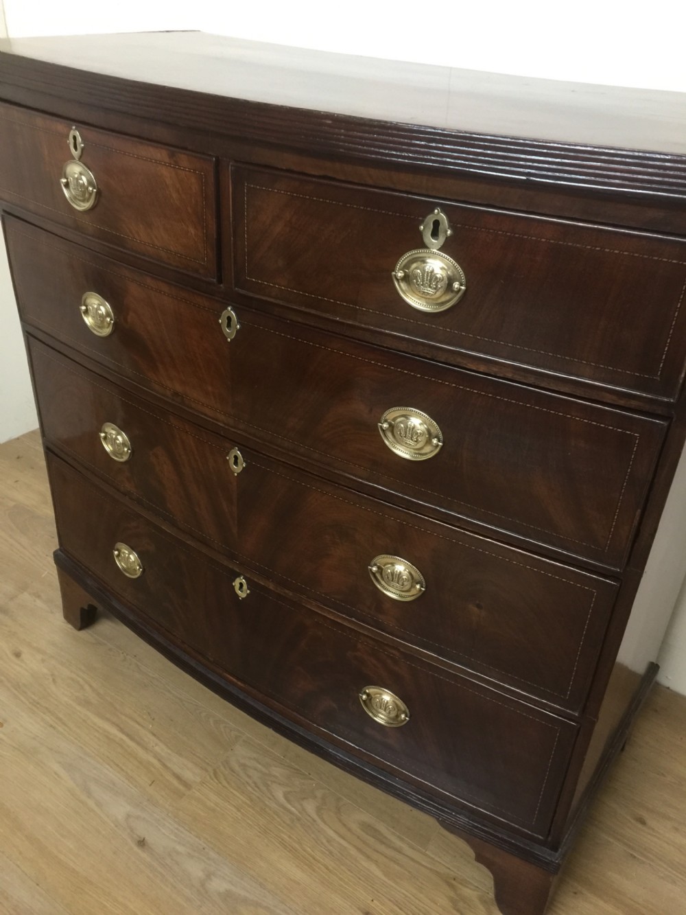 Late Georgian flame mahogany bow front chest of drawers  View II
