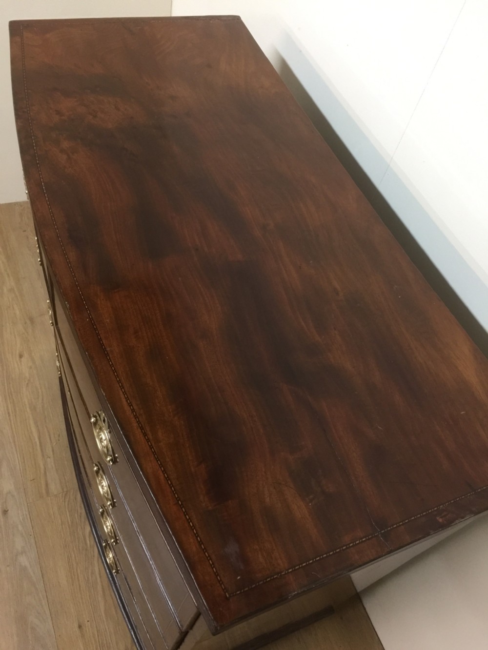 Late Georgian flame mahogany bow front chest of drawers  View VI