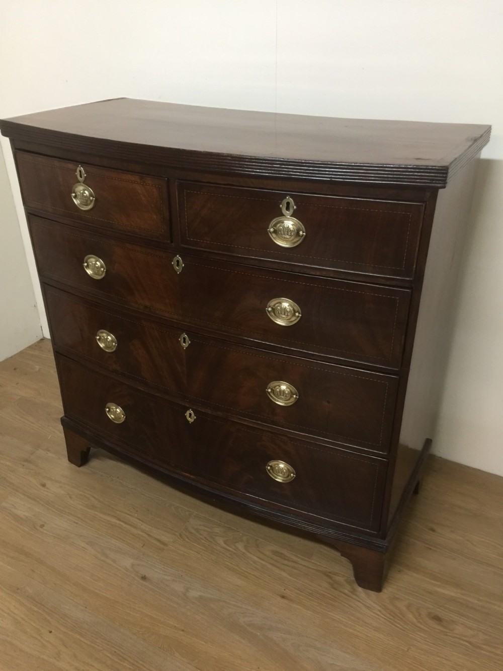 Late Georgian flame mahogany bow front chest of drawers  View IX