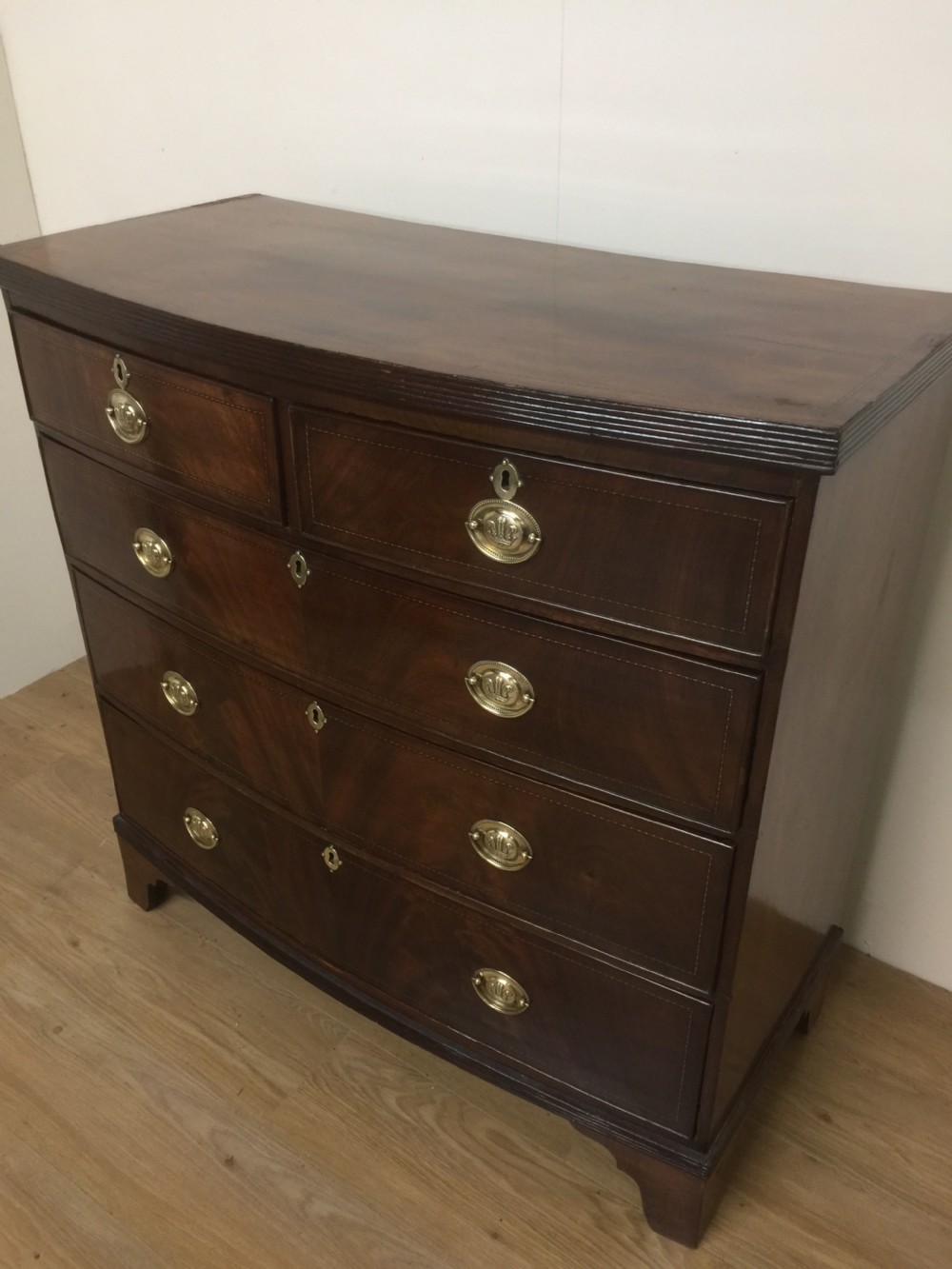 Late Georgian flame mahogany bow front chest of drawers  View XII