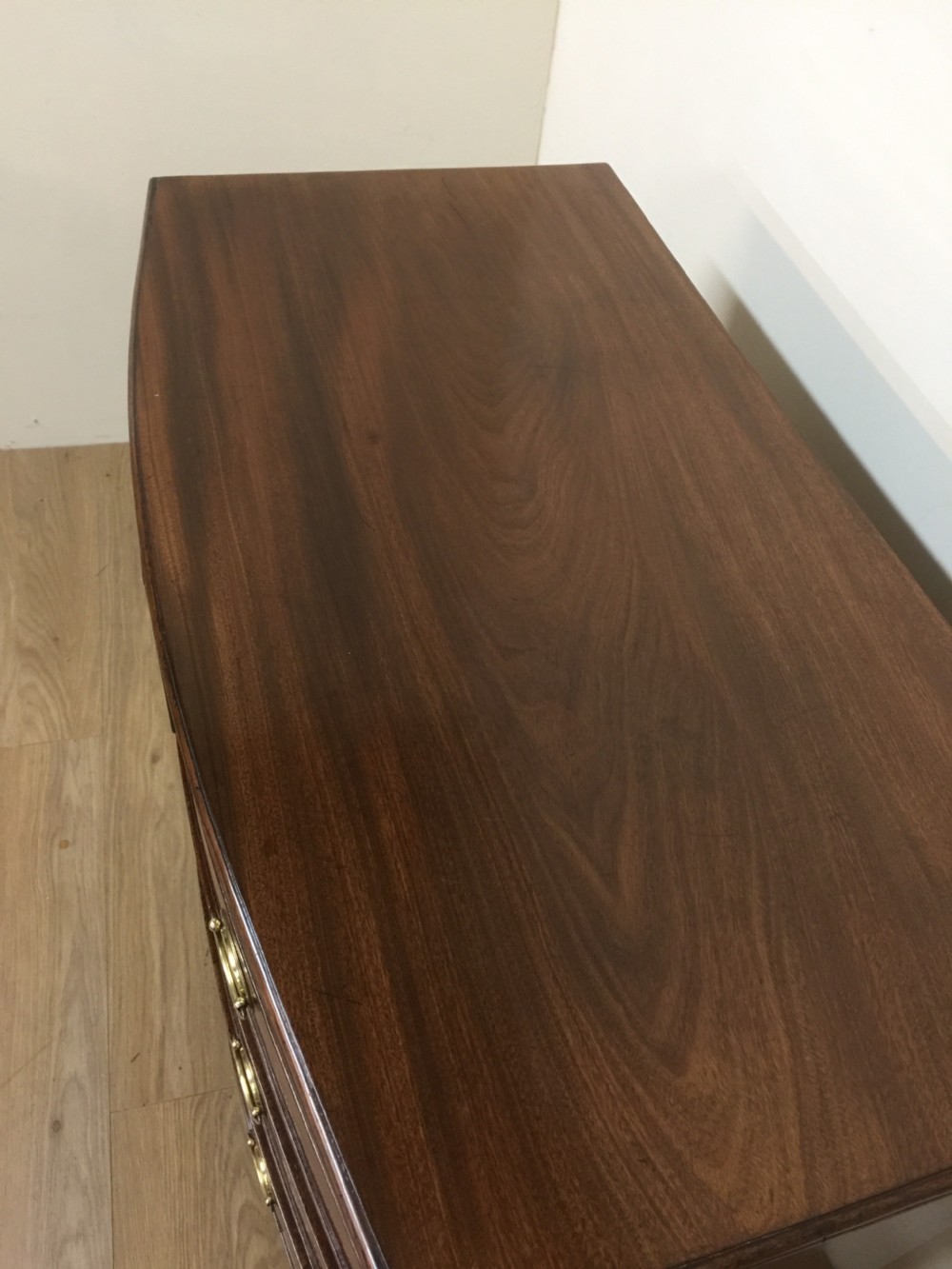 Small Georgian flame mahogany bow front chest of drawers  View III