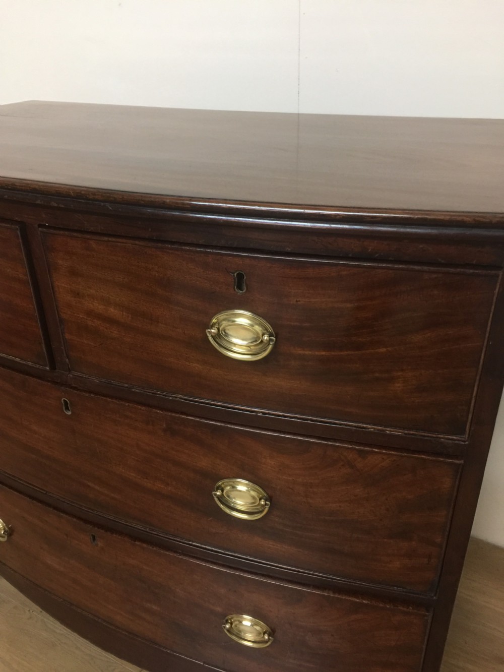 Small Georgian flame mahogany bow front chest of drawers  View IV