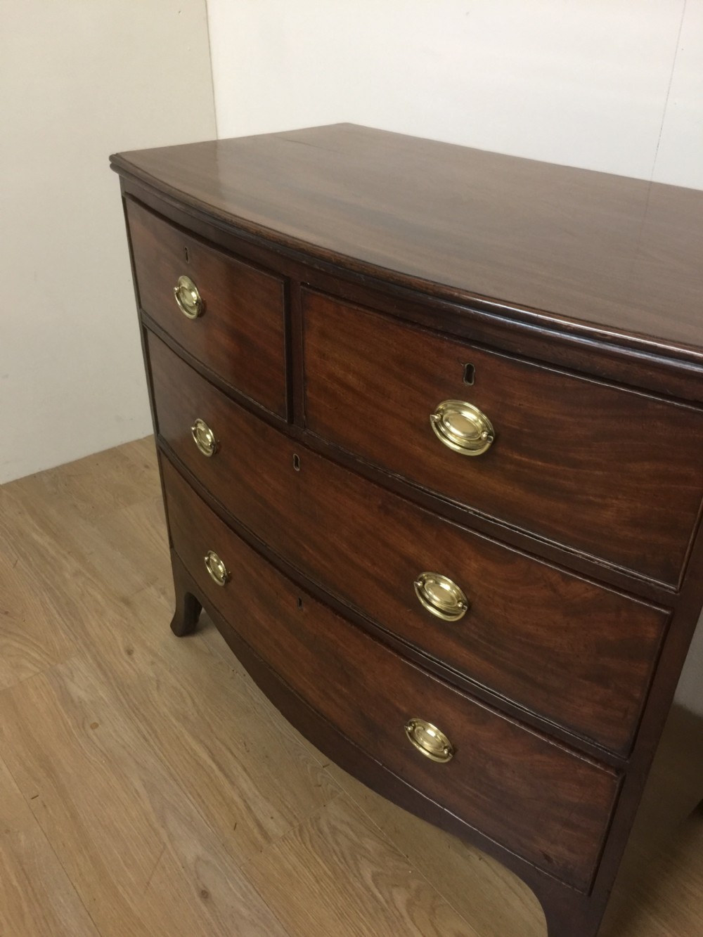Small Georgian flame mahogany bow front chest of drawers  View V