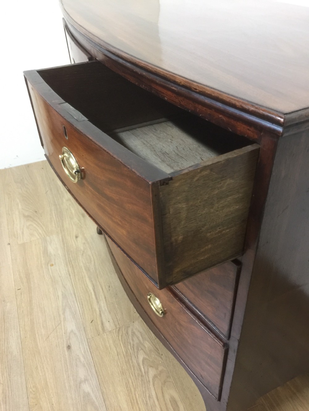 Small Georgian flame mahogany bow front chest of drawers  View VI
