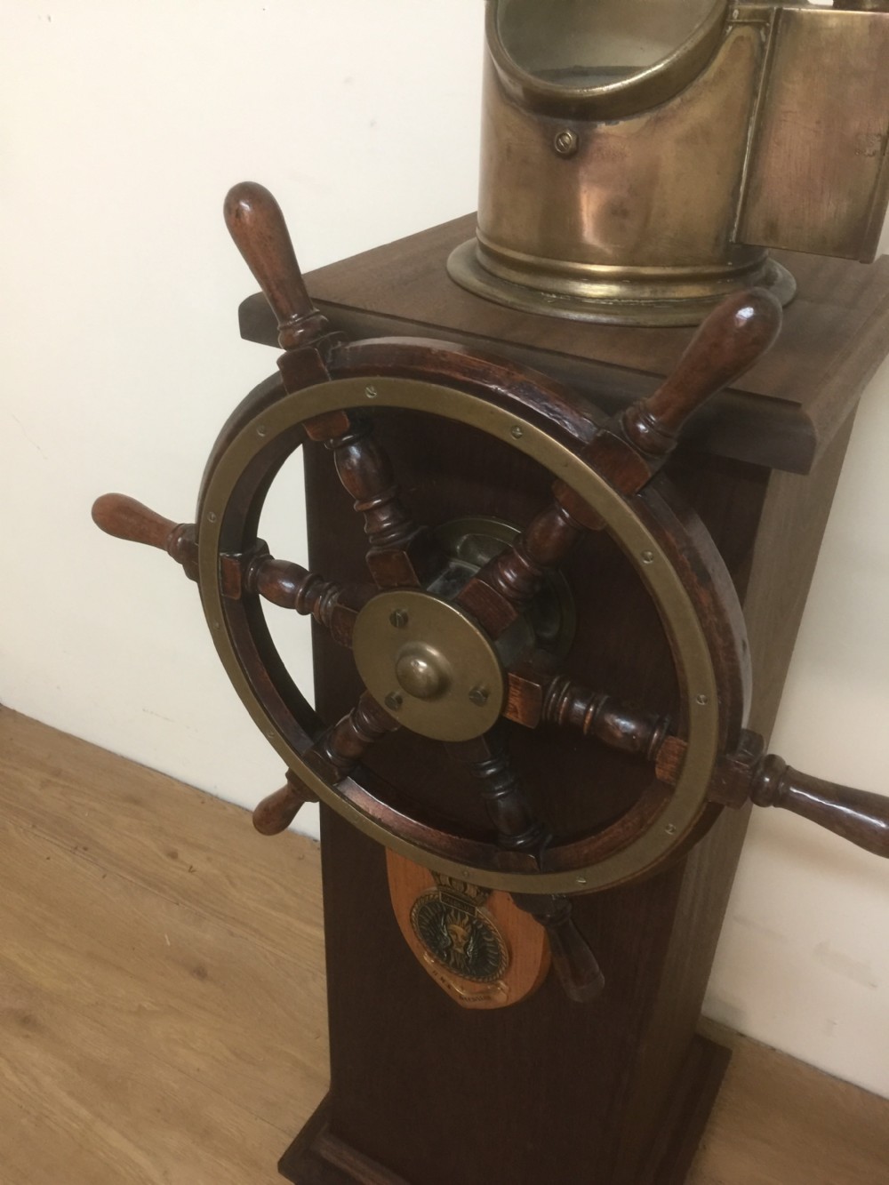 Ships wheel and binnacle on a mahogany plinth  View II