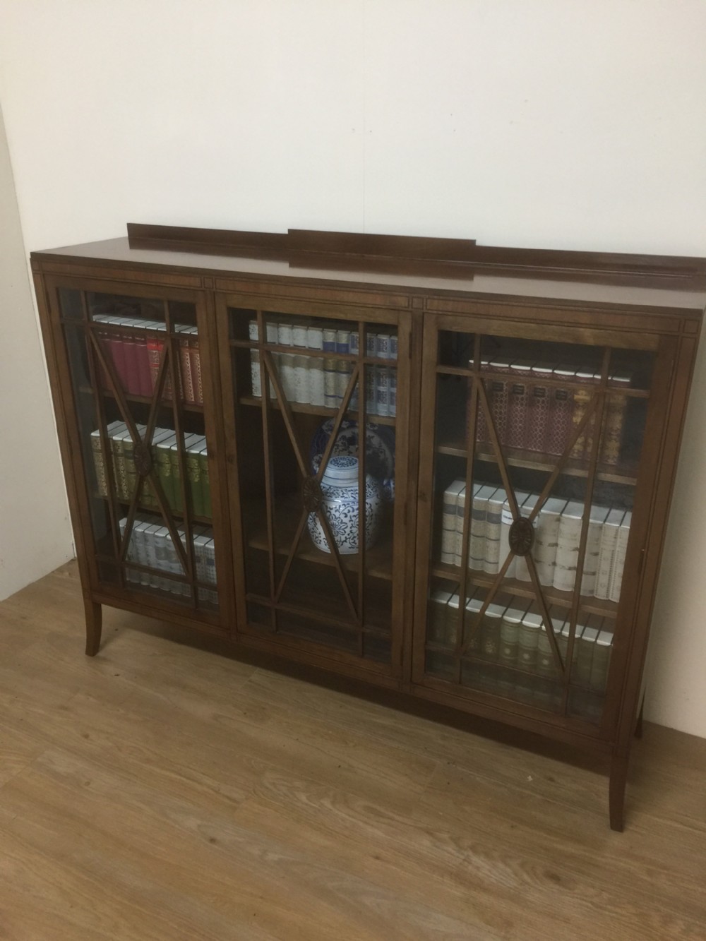 Edwardian mahogany three door glazed bookcase with ebony stringing 
