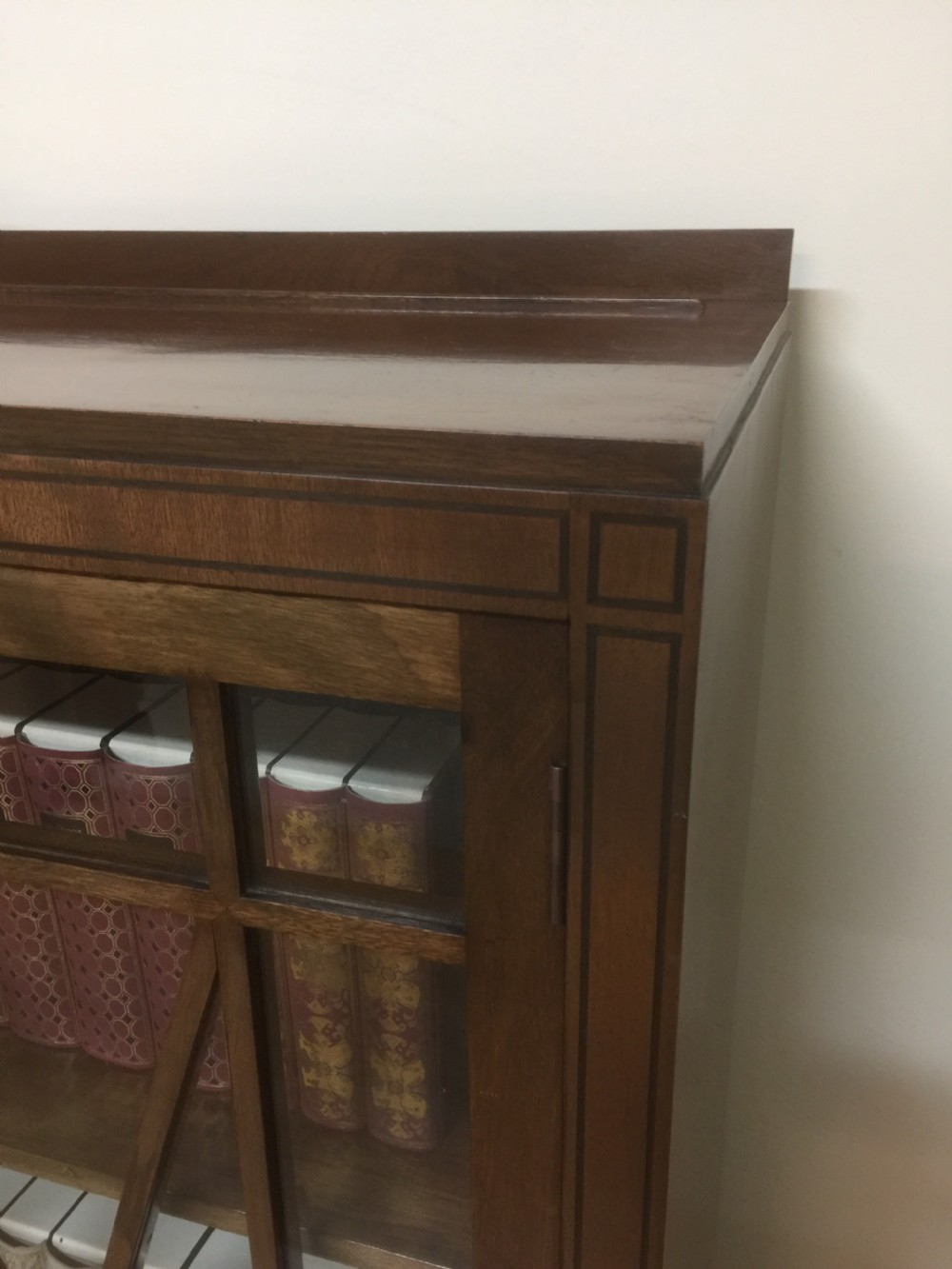 Edwardian mahogany three door glazed bookcase with ebony stringing  View VII