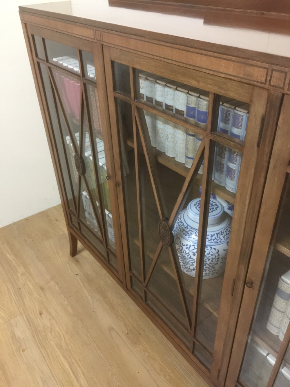 Edwardian mahogany three door glazed bookcase with ebony stringing  View XI