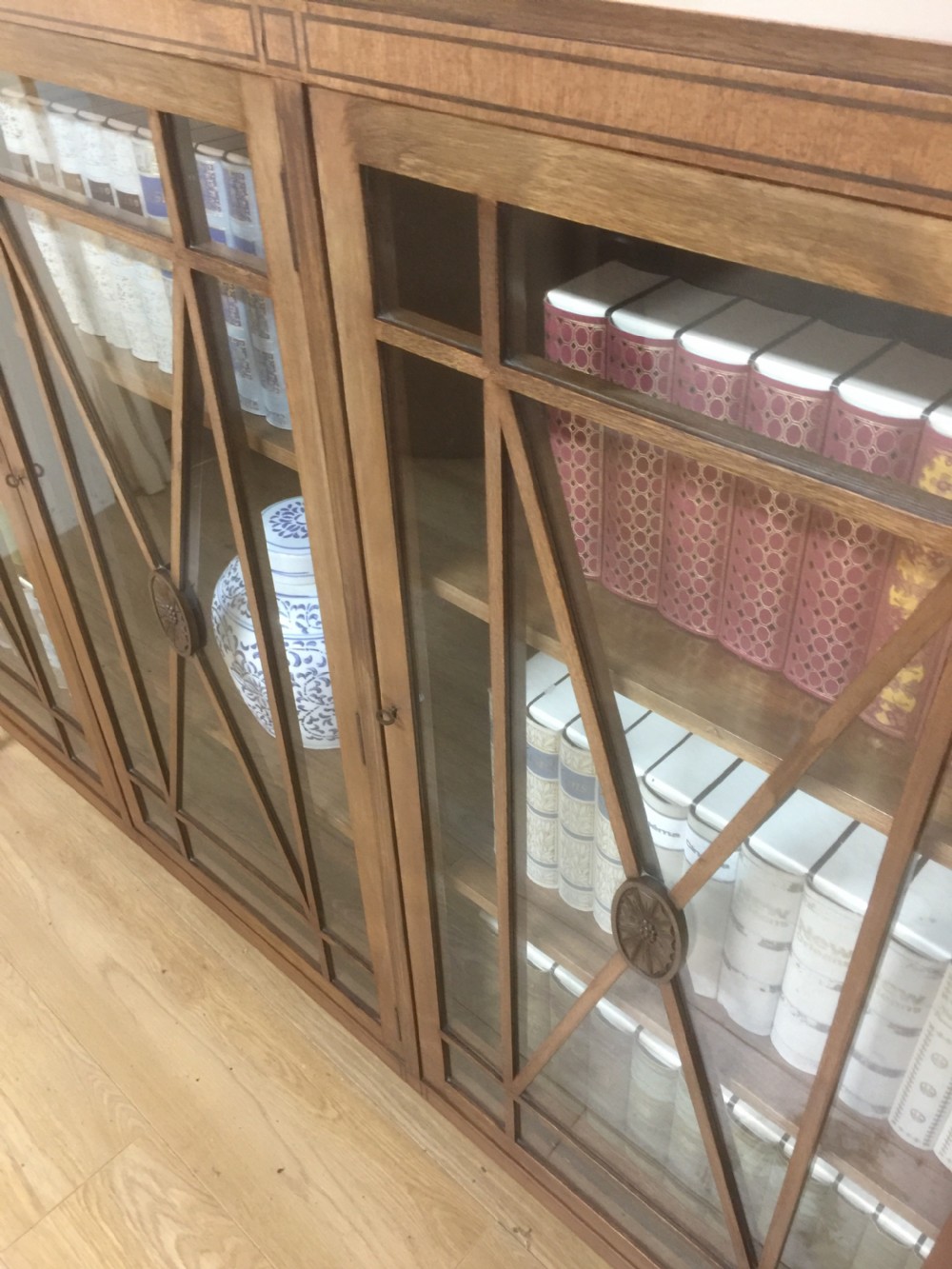 Edwardian mahogany three door glazed bookcase with ebony stringing  View XII