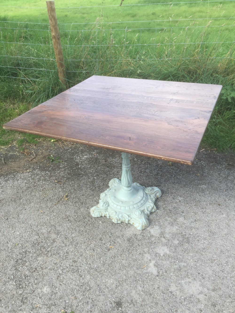Victorian table -cast iron base and golden oak top