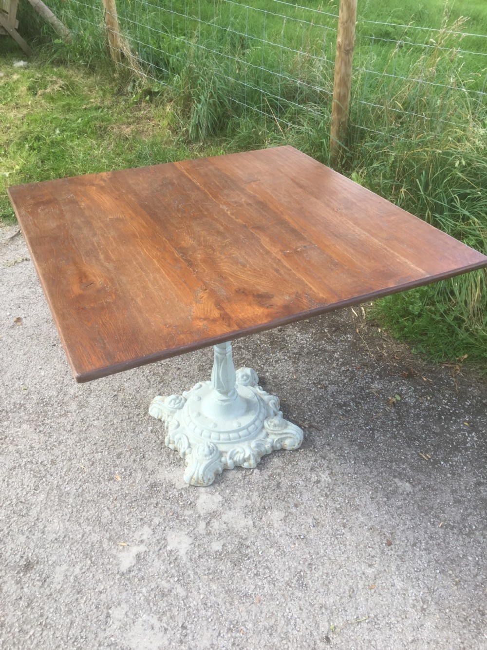 Victorian table -cast iron base and golden oak top View II