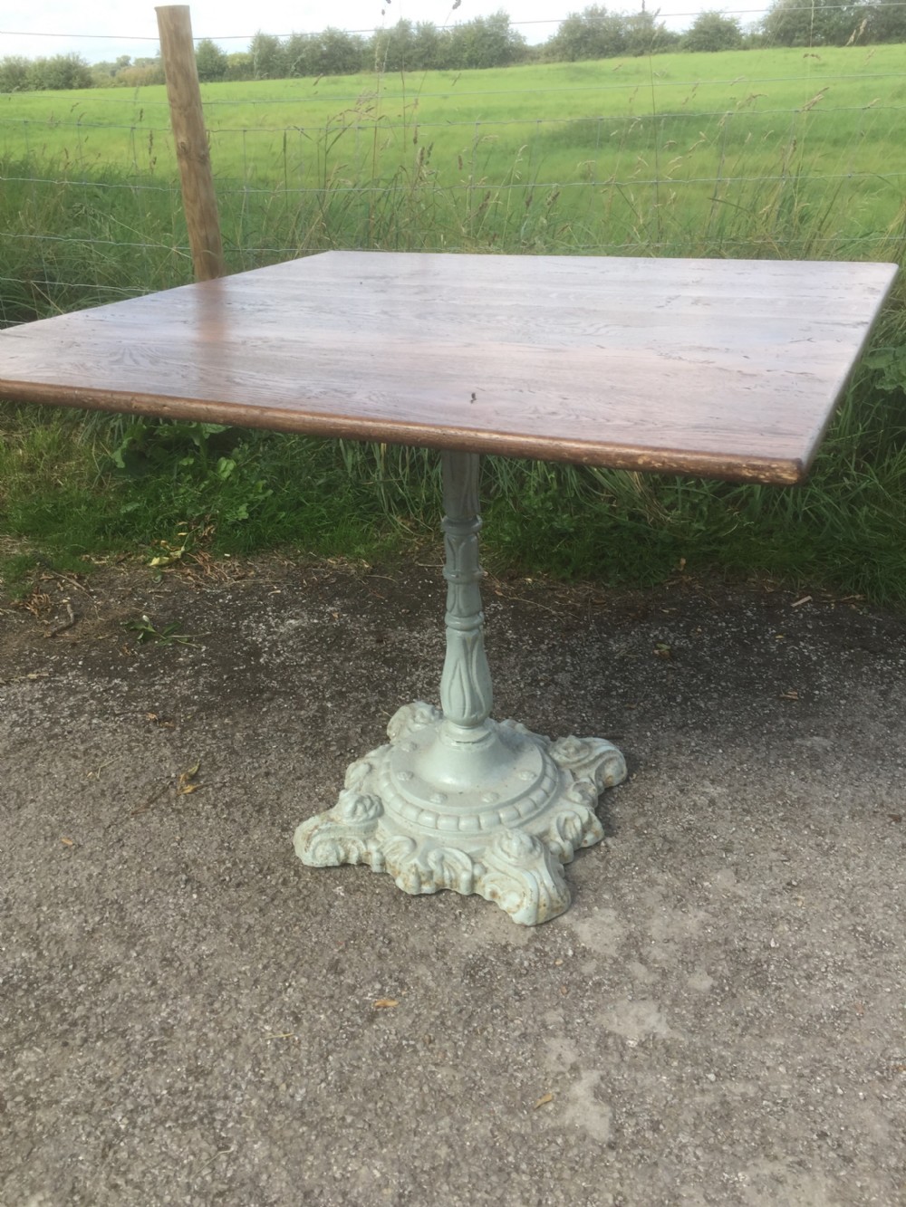 Victorian table -cast iron base and golden oak top View III