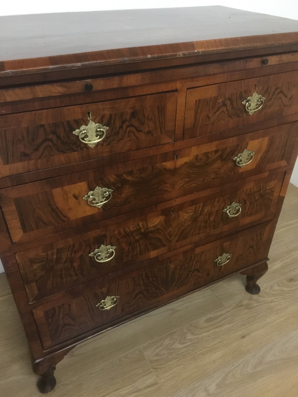 Nineteenth century crossbanded walnut chest of drawers with a dressing slide  View II