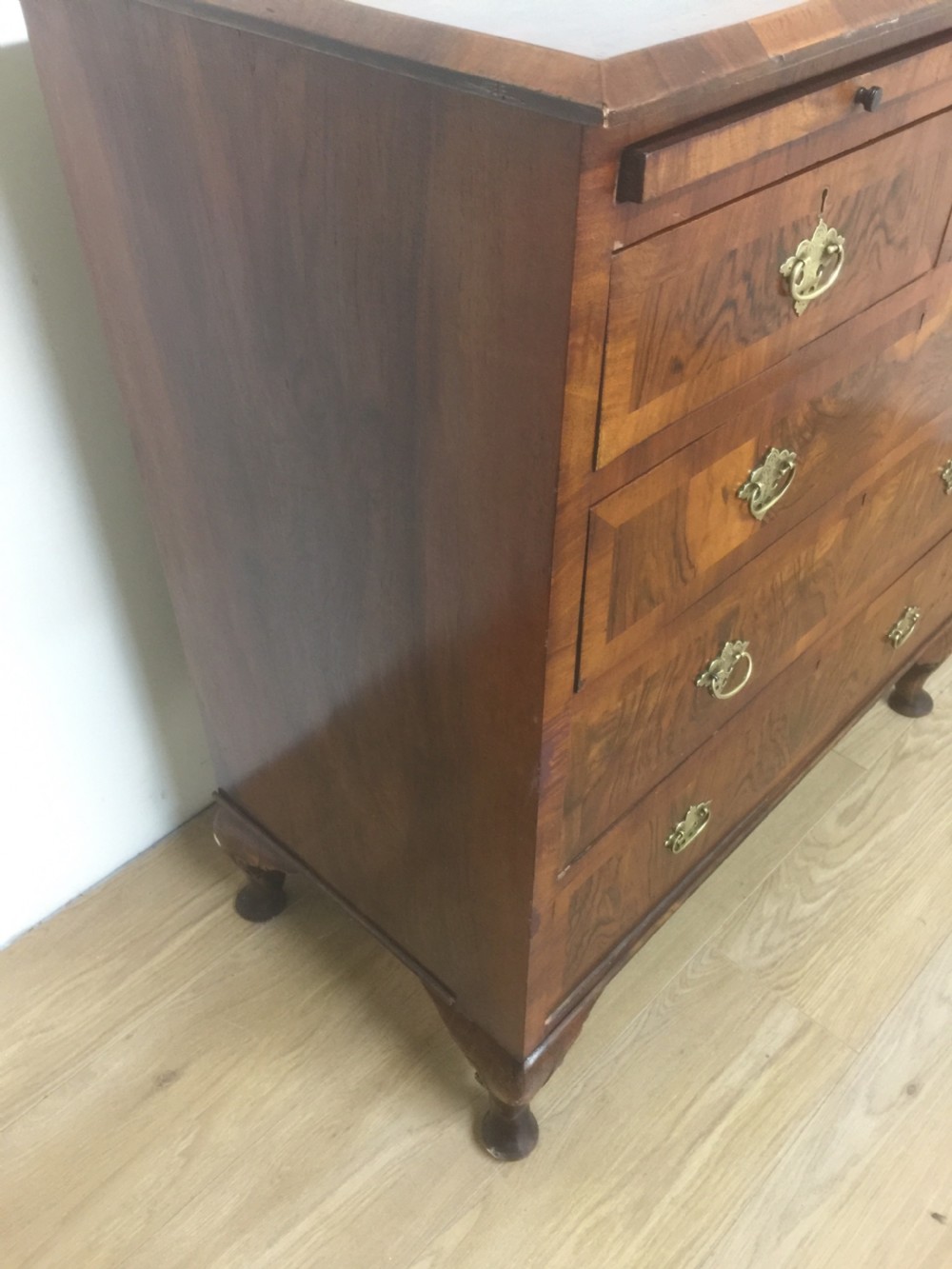Nineteenth century crossbanded walnut chest of drawers with a dressing slide  View IV