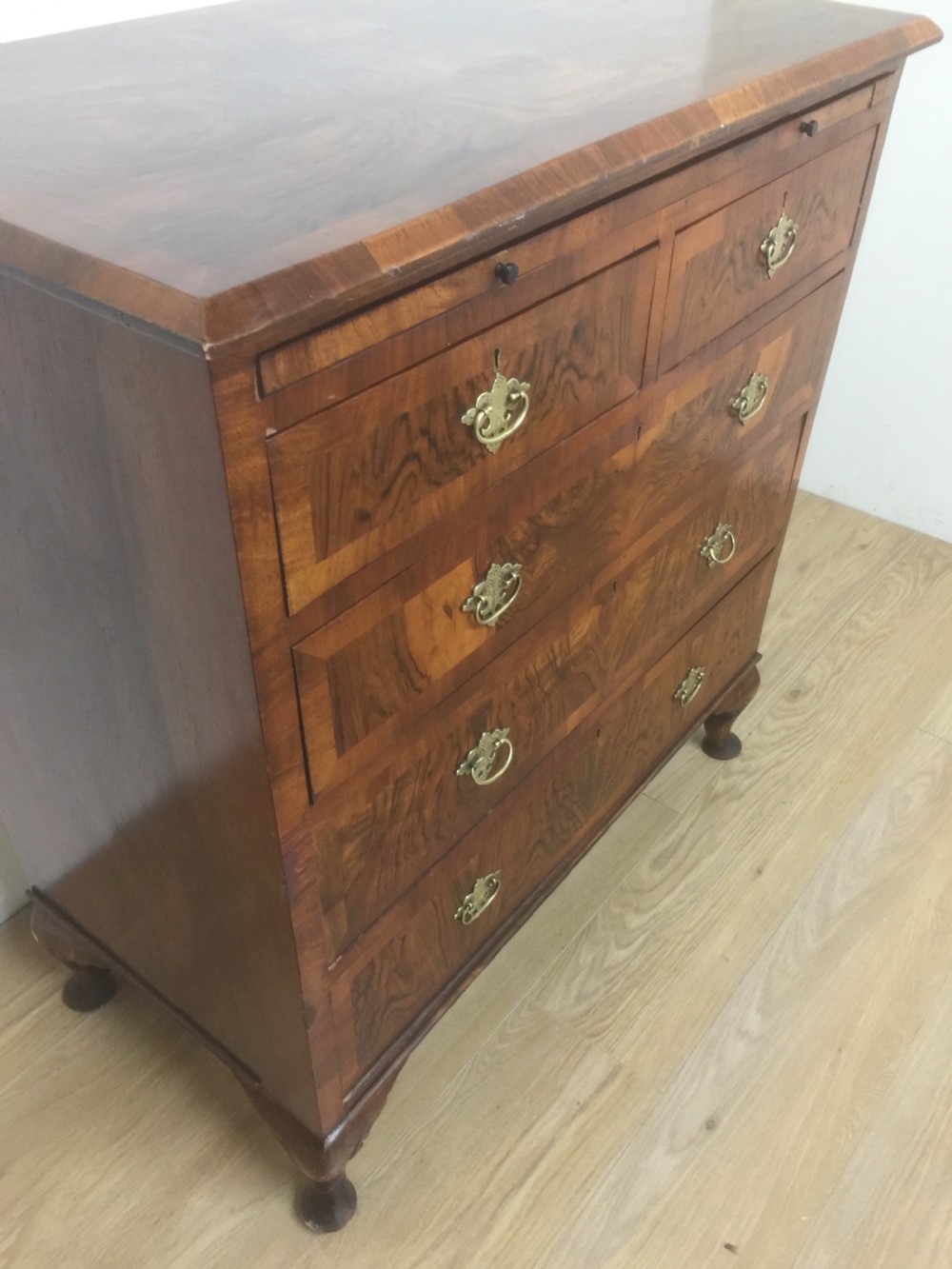 Nineteenth century crossbanded walnut chest of drawers with a dressing slide  View V