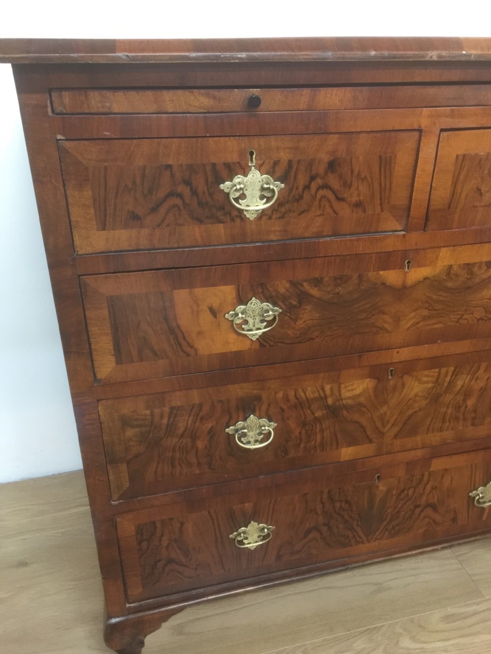 Nineteenth century crossbanded walnut chest of drawers with a dressing slide  View XIII