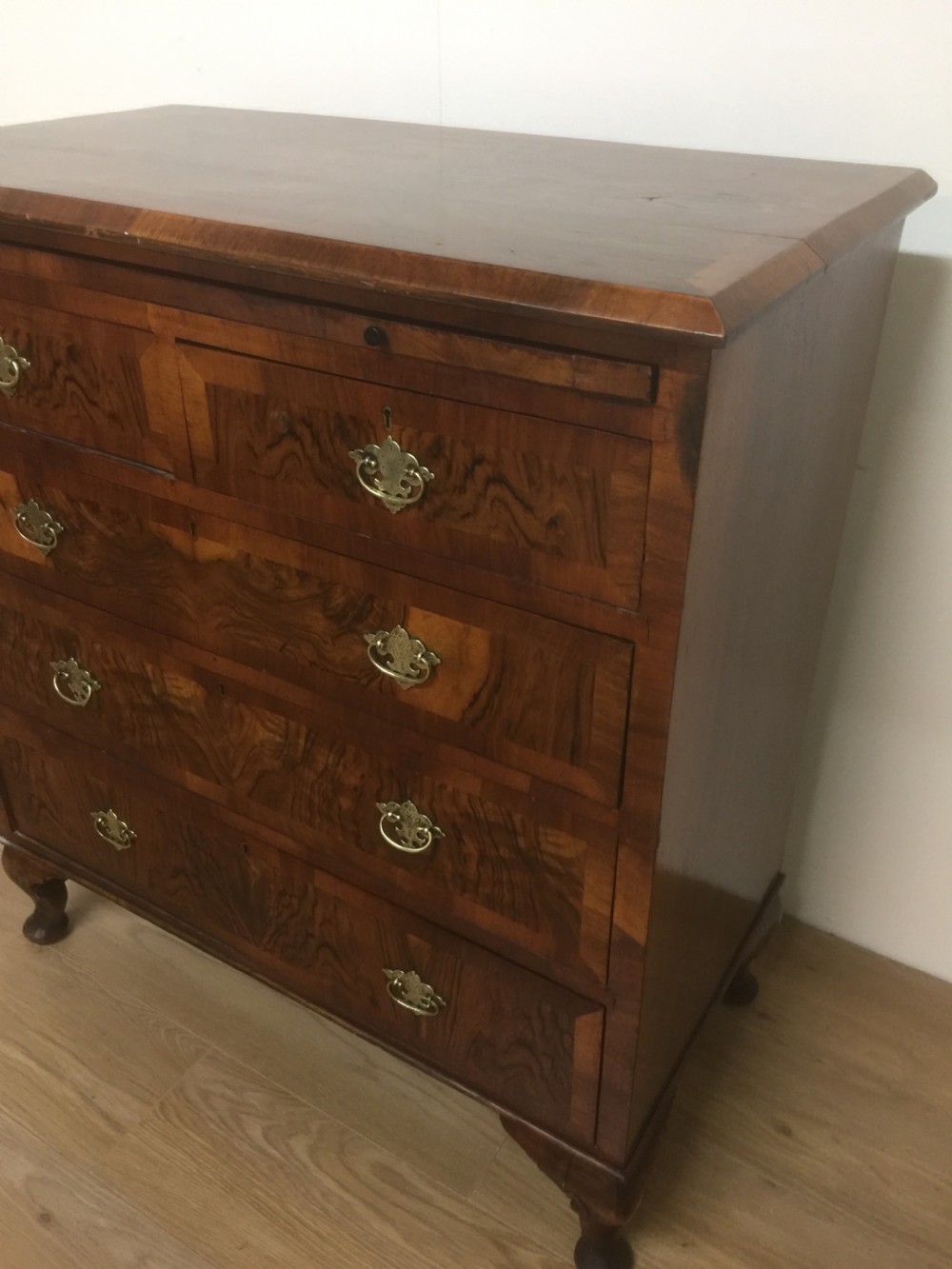 Nineteenth century crossbanded walnut chest of drawers with a dressing slide  View XIV