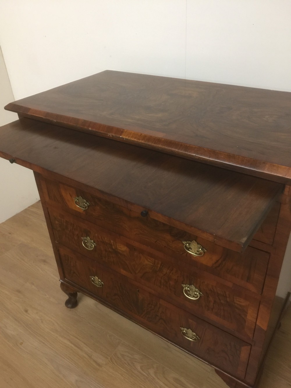 Nineteenth century crossbanded walnut chest of drawers with a dressing slide  View XV