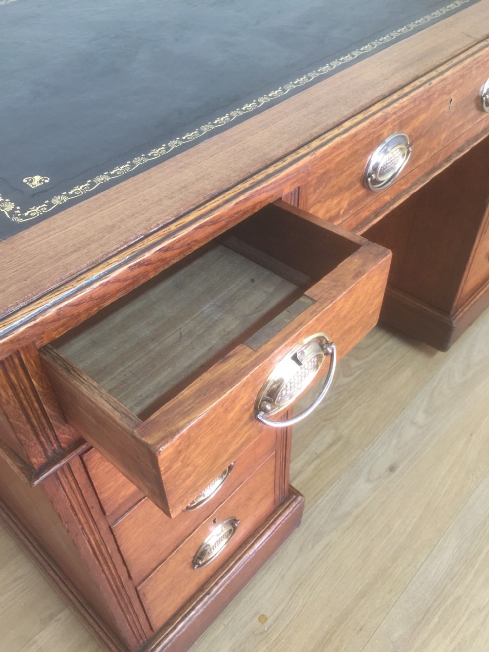 Edwardian golden oak twin Pedestal desk with tooled leather top View XII