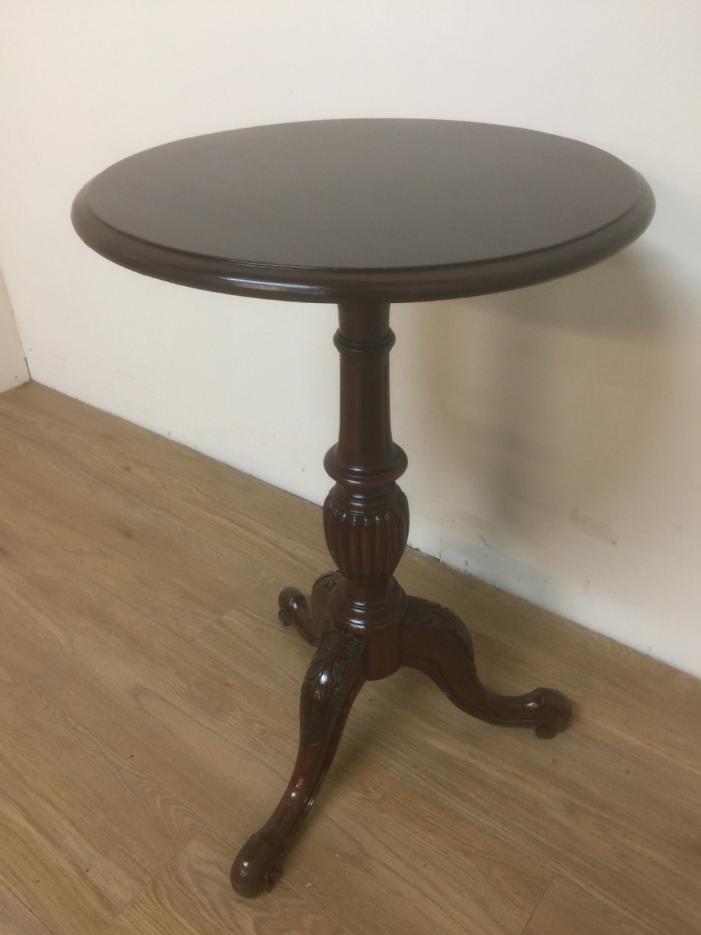 Nineteenth century circular Mahogany wine table on a carved base