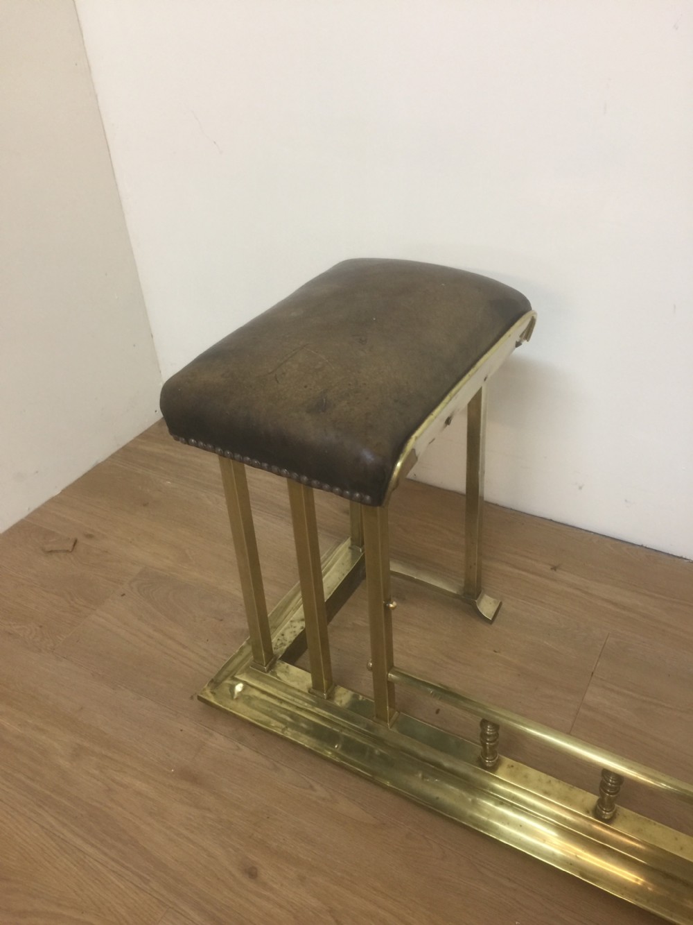 Victorian leather and brass club fender View V
