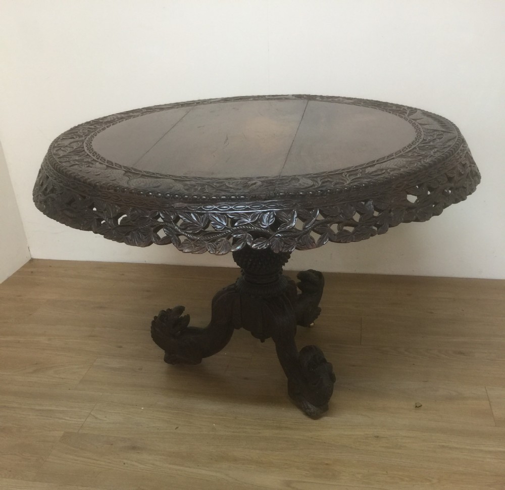 Nineteenth century carved oriental tilt top centre table 
