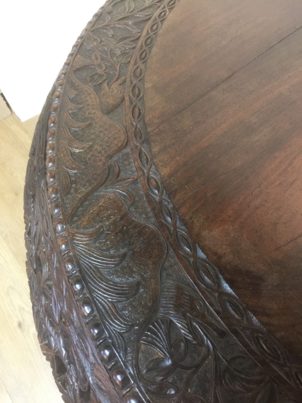 Nineteenth century carved oriental tilt top centre table  View VII