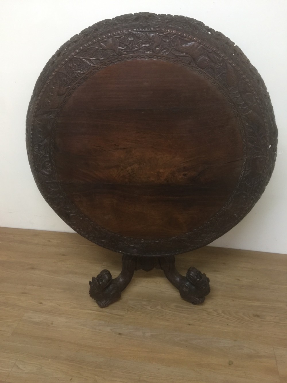 Nineteenth century carved oriental tilt top centre table  View VIII