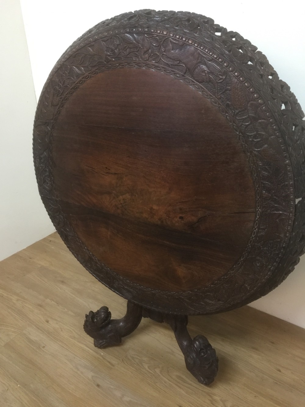 Nineteenth century carved oriental tilt top centre table  View IX