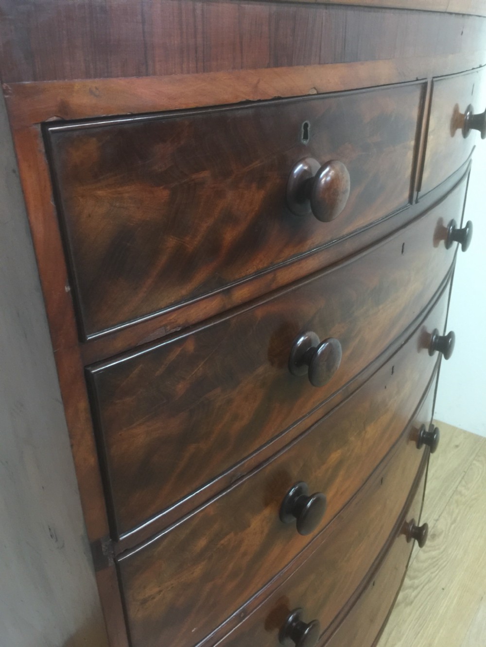 Nineteenth century flame mahogany five height bow fronted chest of drawers  View IX