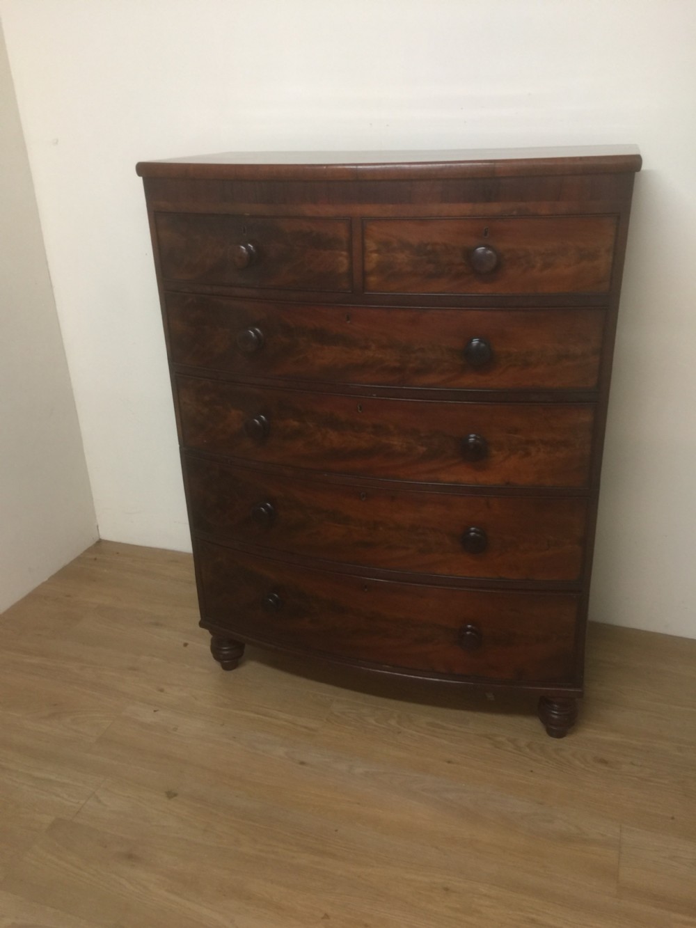 Nineteenth century flame mahogany five height bow fronted chest of drawers  View XI