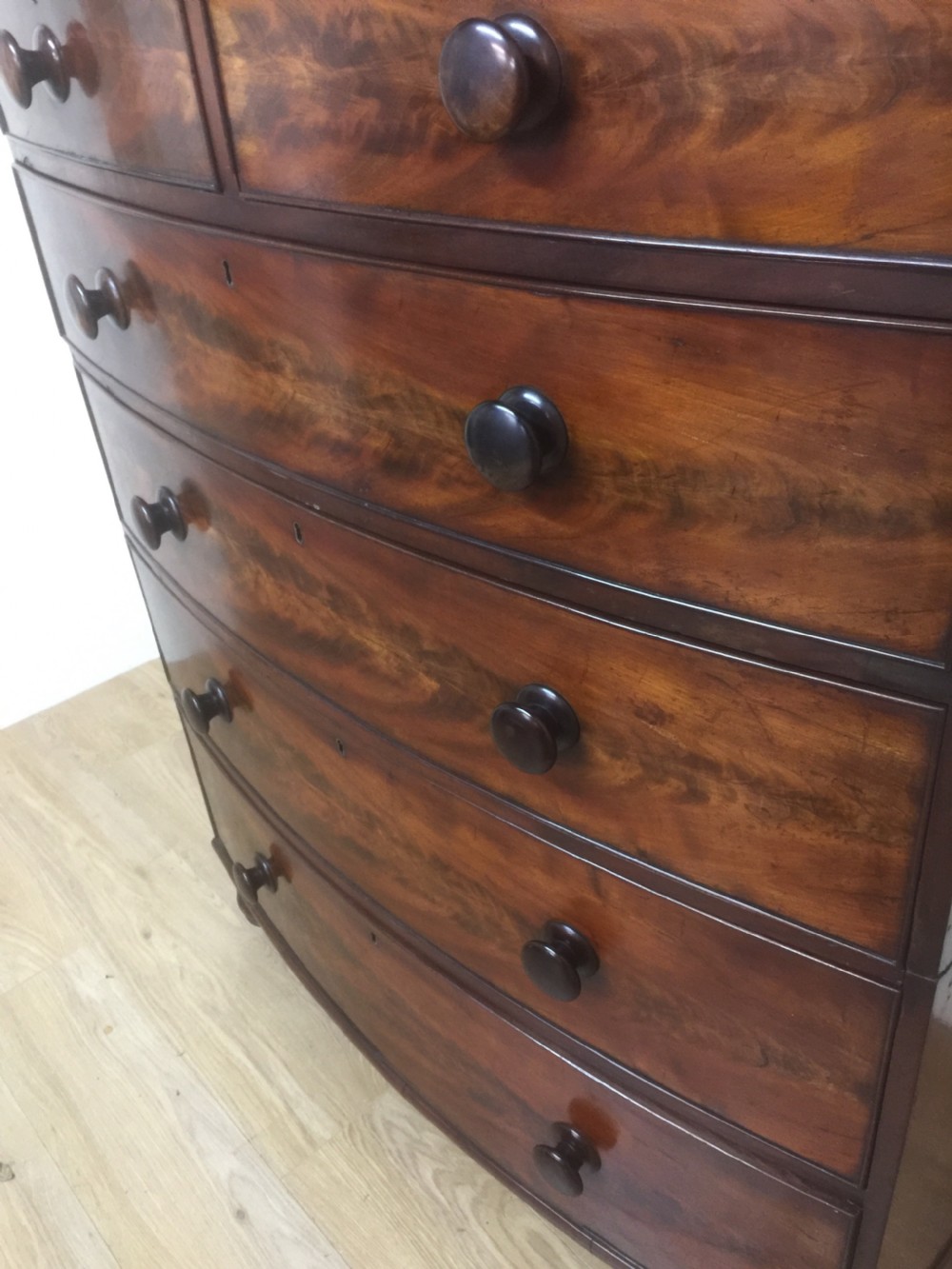 Nineteenth century flame mahogany five height bow fronted chest of drawers  View XIII