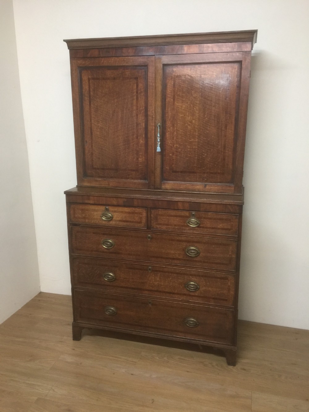 Georgian Oak housekeepers Cupboard crossbanded in Mahogany 