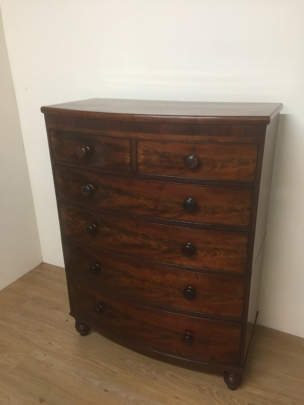 Nineteenth century flame mahogany five height bow fronted chest of drawers 
