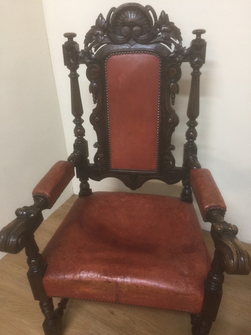 Pair of carved oak baronial chairs in original distressed leather View III