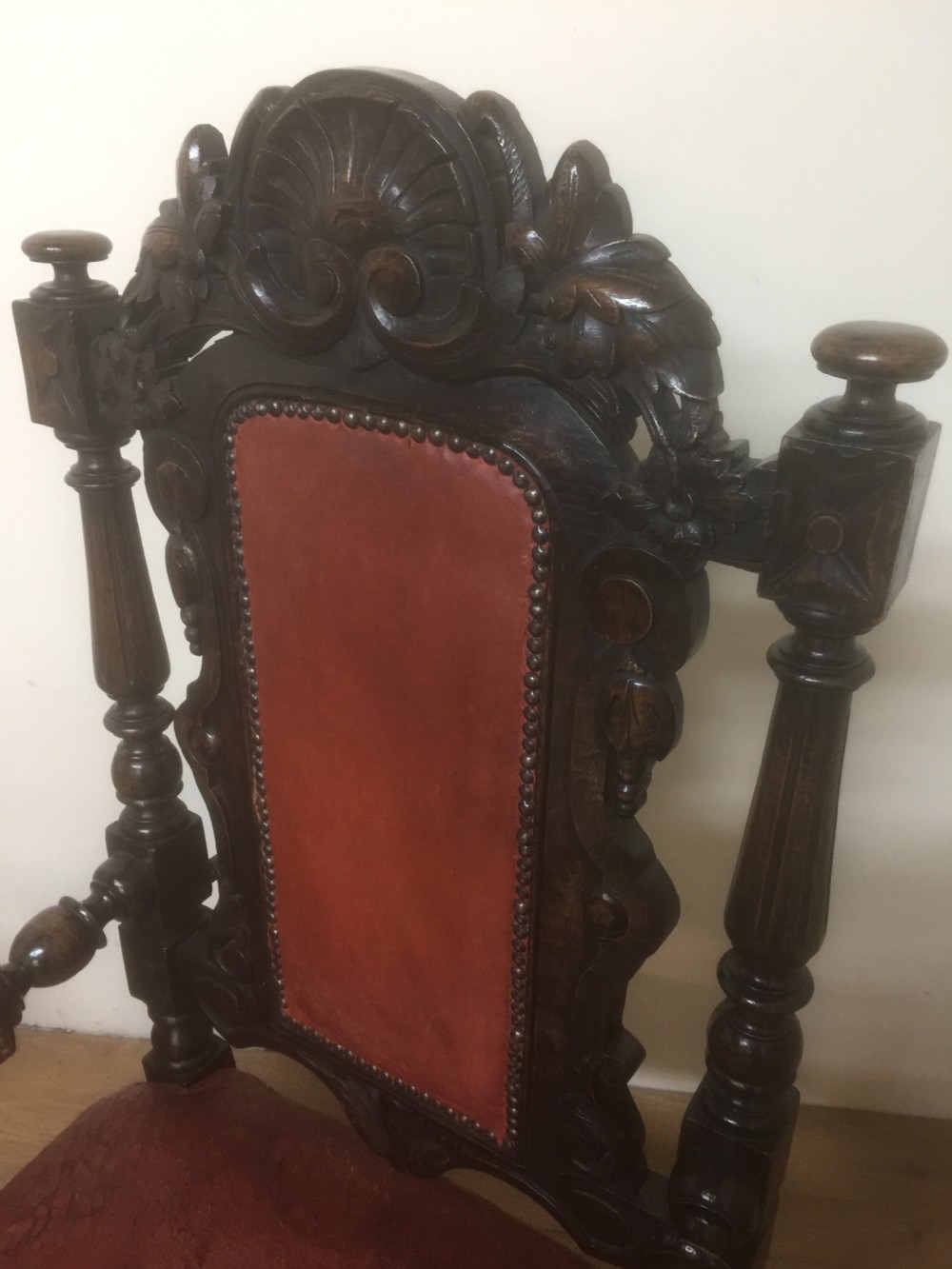 Pair of carved oak baronial chairs in original distressed leather View VI