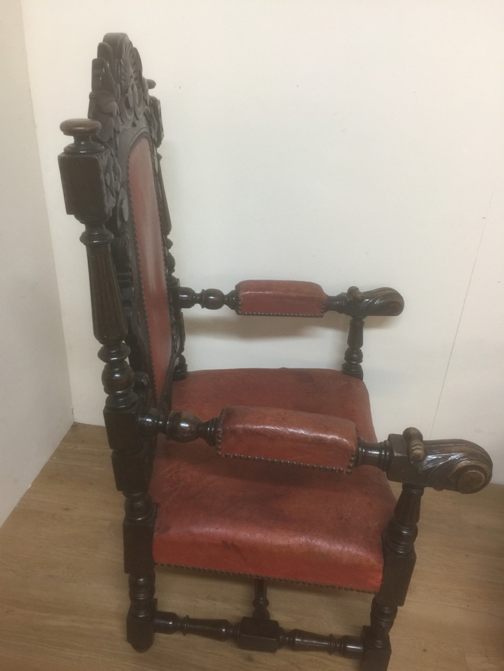 Pair of carved oak baronial chairs in original distressed leather View IX