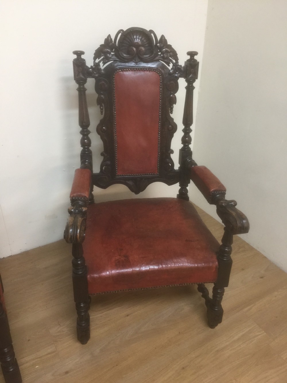 Pair of carved oak baronial chairs in original distressed leather View XI