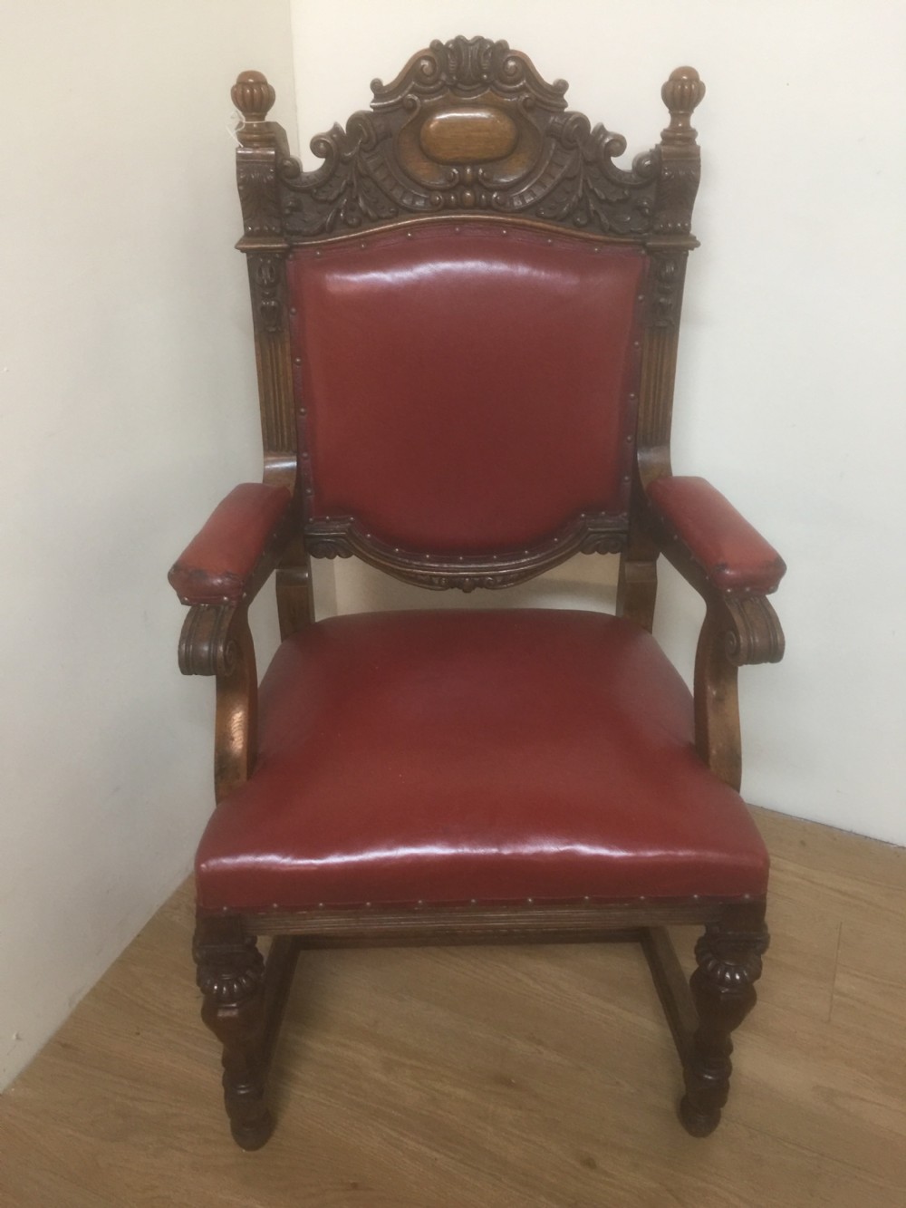 Victorian carved oak armchair in red leather