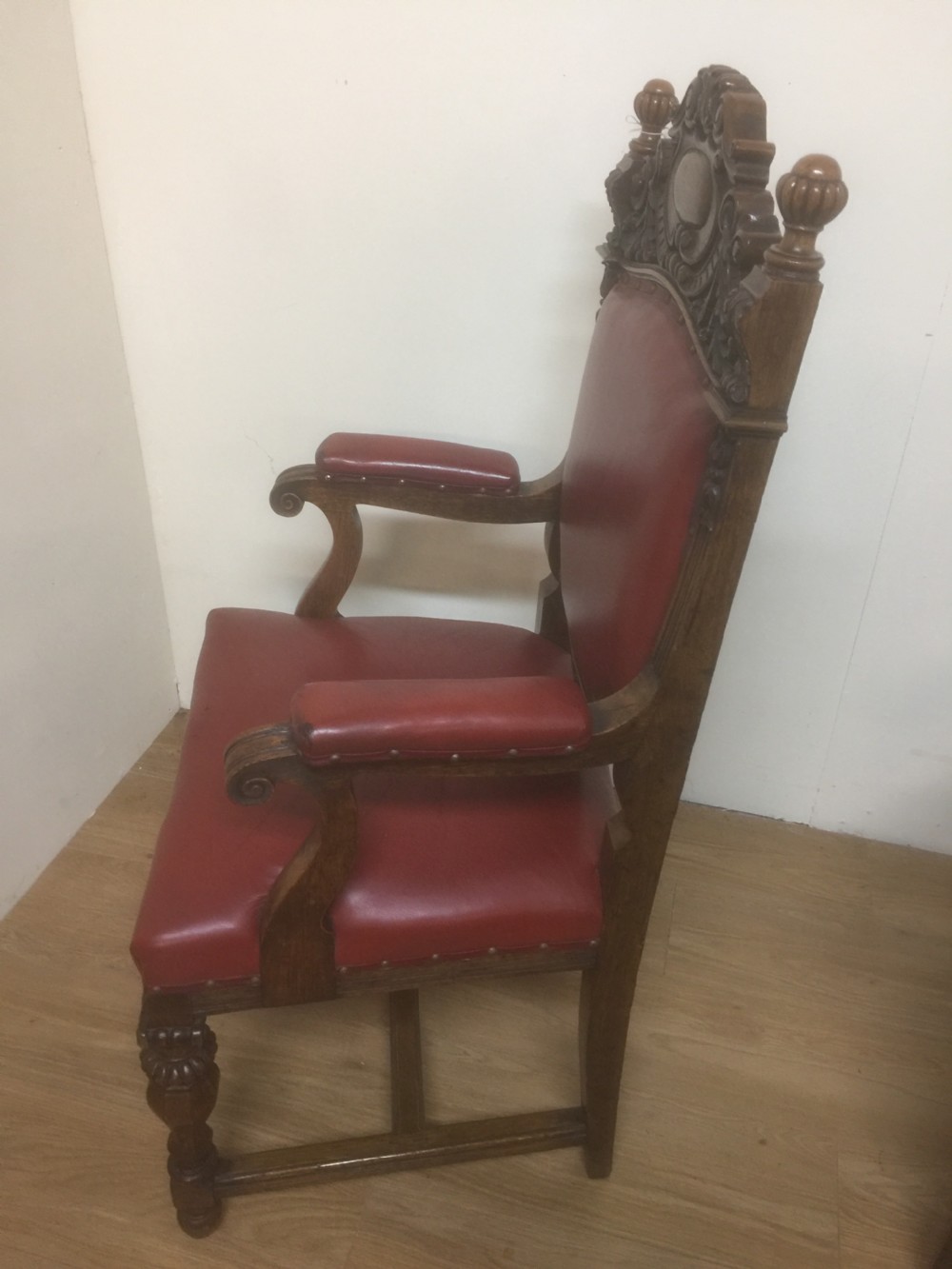 Victorian carved oak armchair in red leather View V