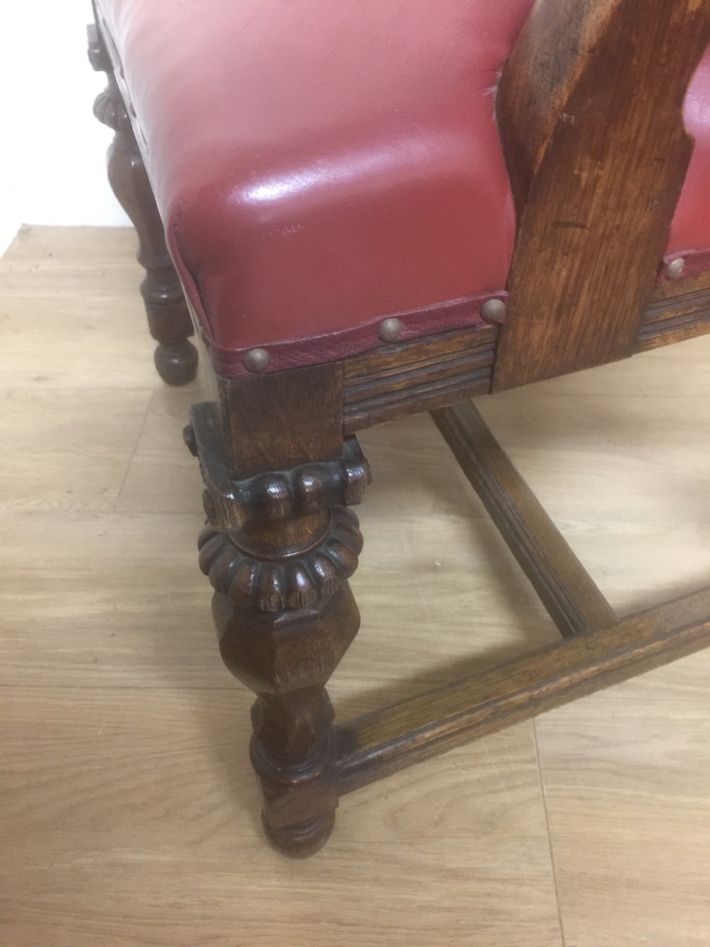 Victorian carved oak armchair in red leather View VI