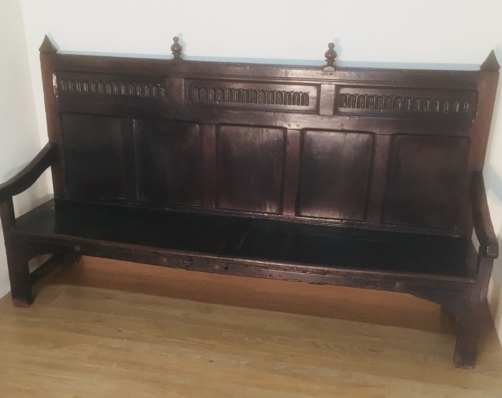 Eighteenth century panelled oak settle 
